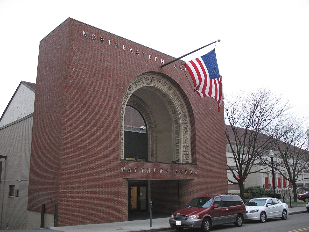 The brick entrance and historic arched doorway of Matthews Arena in 2009